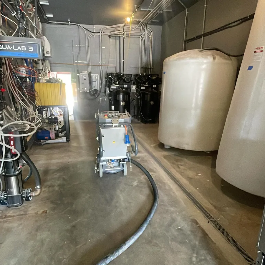 Concrete floor grinding equipment at work in a commercial space
